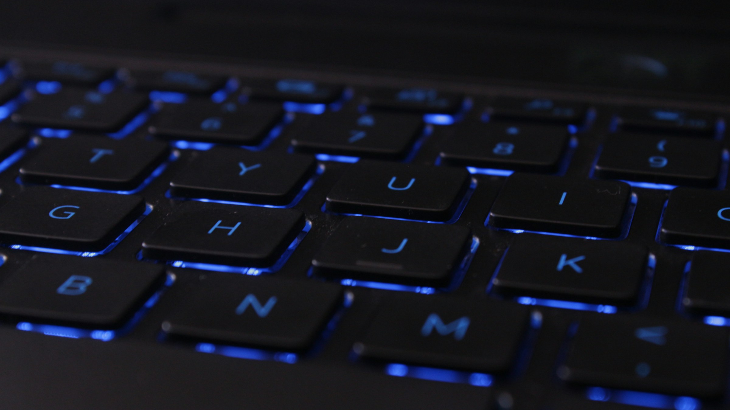 laptop keyboard with blue backlit keys