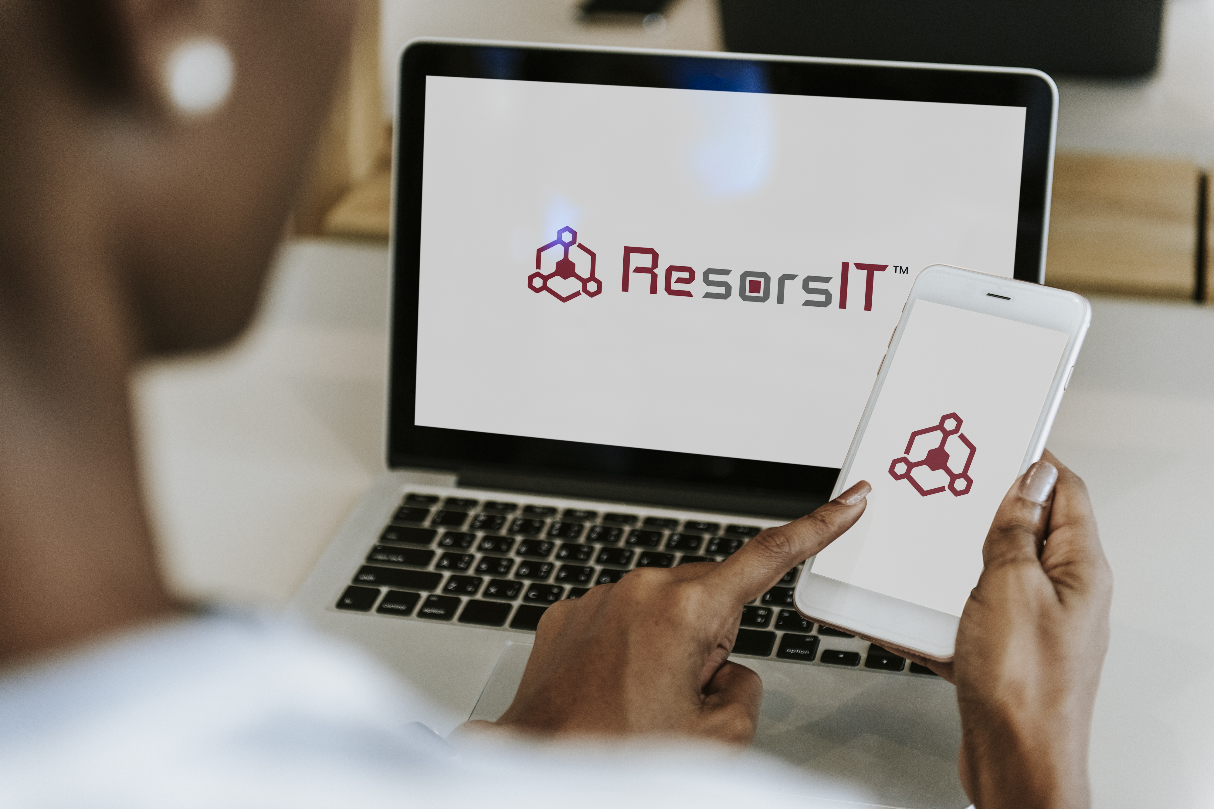 ResorsIT logo on laptop screen